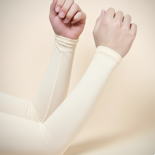 Close-up of beige long-sleeve shirt worn by a person with a plain background
