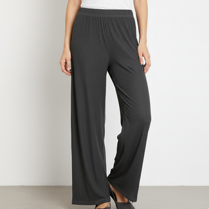 Dark gray wide-leg pants worn by a person on a light gray background